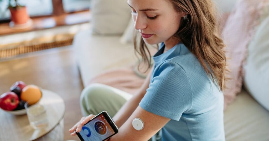 Woman With Diabetes Checking Blood Glucose Level Using Continuous Glucose Monitor