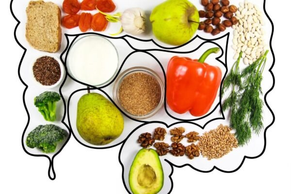 7-day gut-health meal plan with salmon, veggies, and fermented foods on a table.