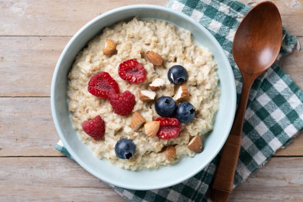 A bowl of oatmeal topped with blueberries, walnuts, and chia seeds, offering a fiber-rich and heart-healthy meal for longevity.