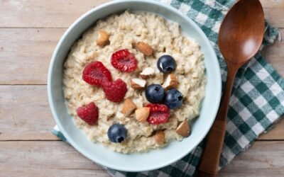 A bowl of oatmeal topped with blueberries, walnuts, and chia seeds, offering a fiber-rich and heart-healthy meal for longevity.